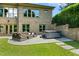 Private backyard patio with comfortable seating and a hot tub, perfect for relaxing and entertaining at 238 Michelangelo Way, Cary, NC 27518