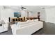 Basement living room with pool table, media center, white sofas, ceiling fan and black tile flooring at 238 Michelangelo Way, Cary, NC 27518