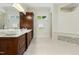 Bright bathroom with dual vanity, granite counters, and mosaic tile accents at 238 Michelangelo Way, Cary, NC 27518