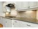 Gourmet kitchen with granite countertops, tiled backsplash, and stainless steel appliances at 238 Michelangelo Way, Cary, NC 27518
