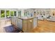 Kitchen with island seating, stainless steel appliances and an open layout leading to the living area at 238 Michelangelo Way, Cary, NC 27518