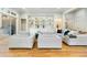 Comfortable living room featuring large seating arrangements, hardwood flooring, and stylish built-in shelving at 238 Michelangelo Way, Cary, NC 27518