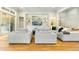 Bright and airy living room with built-in shelving, hardwood floors and plenty of seating at 238 Michelangelo Way, Cary, NC 27518