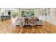 Expansive living area featuring custom woodworking, hardwoods, open floor plan, and seamless indoor-outdoor living at 238 Michelangelo Way, Cary, NC 27518