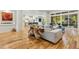 Spacious living area highlighting hardwood floors, unique décor, and seamless access to the outdoor space at 238 Michelangelo Way, Cary, NC 27518
