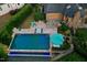 The backyard pool area features lounge chairs, an umbrella, and lush landscaping around the deck at 238 Michelangelo Way, Cary, NC 27518
