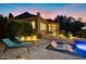 Stunning backyard with a pool featuring submerged loungers and meticulous landscaping at 238 Michelangelo Way, Cary, NC 27518