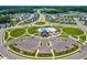 An aerial view of the neighborhood featuring a community clubhouse, parking lot and manicured landscaping at 279 Edge Of Auburn Blvd, Raleigh, NC 27610