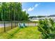 Lush, fenced backyard with two blue Adirondack chairs offering a peaceful retreat at 279 Edge Of Auburn Blvd, Raleigh, NC 27610