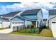 Charming blue home with a fenced-in backyard featuring a cozy screened porch and a two-car garage at 279 Edge Of Auburn Blvd, Raleigh, NC 27610