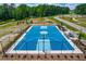 Aerial view of a community basketball court with manicured landscaping around the fence at 279 Edge Of Auburn Blvd, Raleigh, NC 27610