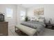 Beautiful bedroom with a bed, a bench, two windows, and nice decorations at 279 Edge Of Auburn Blvd, Raleigh, NC 27610