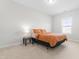 Bedroom featuring a plush queen bed, side table, and a view of the neighborhood at 279 Edge Of Auburn Blvd, Raleigh, NC 27610
