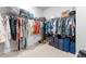 Spacious walk-in closet with ample storage space, shelving, and organized clothing racks at 279 Edge Of Auburn Blvd, Raleigh, NC 27610