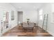Cozy dining room features a stylish table with seating for six and natural light at 279 Edge Of Auburn Blvd, Raleigh, NC 27610