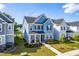 Well-maintained two-story home with manicured lawn, covered entry, and tidy landscaping at 279 Edge Of Auburn Blvd, Raleigh, NC 27610