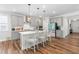 Bright kitchen featuring stainless steel appliances, a center island with seating, and modern pendant lights at 279 Edge Of Auburn Blvd, Raleigh, NC 27610