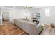 Inviting living room featuring a cozy fireplace, large TV, and comfortable sectional sofa at 279 Edge Of Auburn Blvd, Raleigh, NC 27610