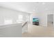 Upstairs loft area with neutral carpet, natural light, and space for relaxation or entertainment at 279 Edge Of Auburn Blvd, Raleigh, NC 27610