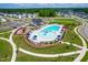 Aerial view of a community pool and playground with lush landscaping at 279 Edge Of Auburn Blvd, Raleigh, NC 27610