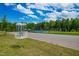 Well-maintained sport court is surrounded by lush greenery offering a recreational amenity at 279 Edge Of Auburn Blvd, Raleigh, NC 27610