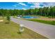 Sport court is complete with trees and picnic tables providing a relaxing gathering space at 279 Edge Of Auburn Blvd, Raleigh, NC 27610