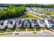 Beautiful new construction homes on a tree-lined street with sidewalks creating a welcoming neighborhood at 279 Edge Of Auburn Blvd, Raleigh, NC 27610