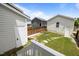 Charming backyard featuring stone path, new grass and privacy fence at 282 Granite Mill Blvd, Chapel Hill, NC 27516