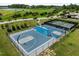 Aerial view of the community basketball court and pickleball courts with well-maintained surfaces and equipment at 282 Granite Mill Blvd, Chapel Hill, NC 27516