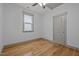 Cozy bedroom with hardwood floors, natural light, and a closet at 282 Granite Mill Blvd, Chapel Hill, NC 27516