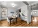 Bright dining room with hardwood floors, stylish decor, and seamless kitchen access at 282 Granite Mill Blvd, Chapel Hill, NC 27516