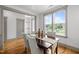 Inviting dining room featuring hardwood floors, large windows, and elegant chair seating at 282 Granite Mill Blvd, Chapel Hill, NC 27516