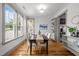 Sunlit dining room with hardwood floors and elegant decor, perfect for Gathering meals at 282 Granite Mill Blvd, Chapel Hill, NC 27516