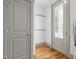 Functional entryway featuring hardwood floors, coat hooks, and a glass-paneled front door at 282 Granite Mill Blvd, Chapel Hill, NC 27516