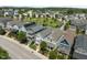 Street view of upscale homes, showcasing front porches, mature trees, landscaping, and well-kept lawns at 282 Granite Mill Blvd, Chapel Hill, NC 27516