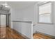 Bright hallway features hardwood floors and a window providing natural light at 282 Granite Mill Blvd, Chapel Hill, NC 27516