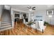 Spacious living room with hardwood floors, an open layout, and seamless kitchen access at 282 Granite Mill Blvd, Chapel Hill, NC 27516