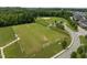 Aerial view of the community sports field featuring baseball diamond and soccer fields surrounded by a neighborhood at 282 Granite Mill Blvd, Chapel Hill, NC 27516