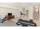 Spacious finished basement with fitness equipment, TV, and stairs is perfect for activities and relaxation at 3109 Stockdale Dr, Raleigh, NC 27609