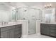 Beautiful bathroom featuring a glass shower, double vanities, and modern fixtures at 3109 Stockdale Dr, Raleigh, NC 27609
