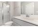 Modern bathroom featuring a glass-enclosed shower, white subway tile, and sleek vanity at 3109 Stockdale Dr, Raleigh, NC 27609