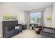 Brightly lit Bedroom with gray and blue color scheme and a baseball glove chair creating a cozy space at 3109 Stockdale Dr, Raleigh, NC 27609