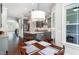 Open-concept kitchen boasts gray cabinetry, a center island, and a bright adjacent dining area at 3109 Stockdale Dr, Raleigh, NC 27609