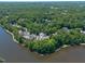 An aerial view of the community surrounded by lush greenery and serene lake views at 313 Glen Echo Ln # J, Cary, NC 27518