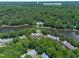 Aerial view showcasing the community's proximity to Downtown Raleigh and a scenic lake at 313 Glen Echo Ln # J, Cary, NC 27518
