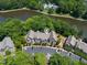 A beautiful aerial shot of the community nestled in lush greenery alongside a lake at 313 Glen Echo Ln # J, Cary, NC 27518