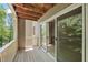 Wooden balcony featuring sliding glass doors at 313 Glen Echo Ln # J, Cary, NC 27518