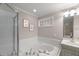 Bathroom with large soaking tub with jets, a glass shower, and a sink at 313 Glen Echo Ln # J, Cary, NC 27518