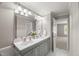 Well-lit bathroom featuring a double sink vanity and neutral wall coloring at 313 Glen Echo Ln # J, Cary, NC 27518