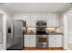 Well-appointed kitchen with stainless steel appliances and ample countertop space at 313 Glen Echo Ln # J, Cary, NC 27518